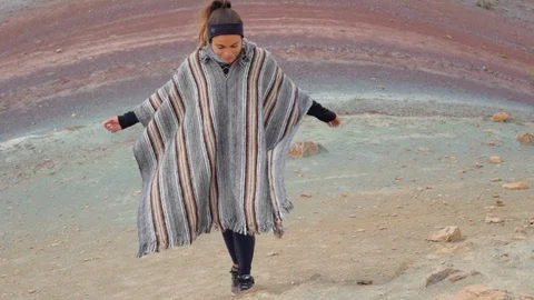 High angle view of smiling young tourist moving up on mountain, woman wearing Stock Footage 128853595