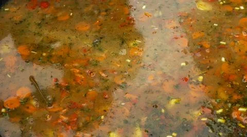High angle view of soup in a cast iron vat. Close-up of cooking meal. Space f Stock Photos
