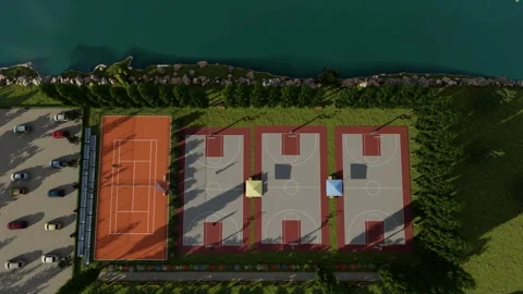 High angle view of sports base camp near a lake, tennis and basketball court Stock Footage 160549583