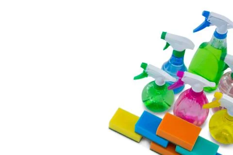 High angle view of spray bottles and cleaning sponge Photos