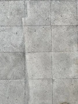 High angle view of square concrete paving slabs texture background Stock Photos