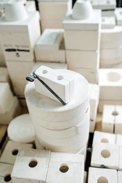 High angle view on a stack of molds for casting tableware of different shape. Stock Photos