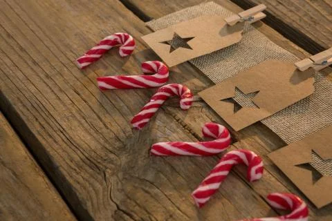 High angle view of star shape decoration with burlap and clothespin by candy Fotos de archivo