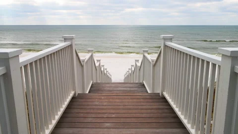High angle view steps by beach at Gulf of Mexico at Seaside, Florida Stock Footage 164671061