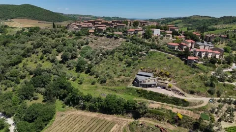High Angle View of Stone Villa on Tuscan Slope Surrounded by Groves Stock Footage 345550080