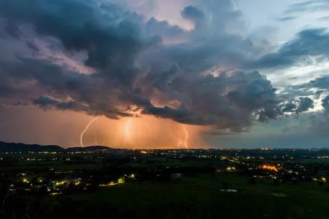 High angle view of Storm and lightning over villages Foto stock