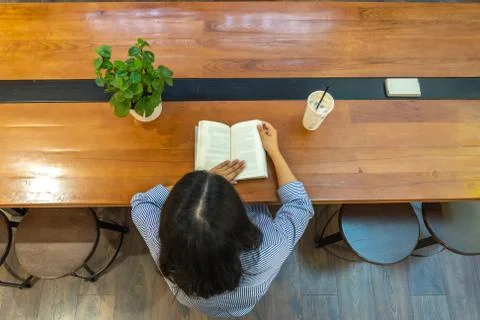 High angle view of student reading book Foto stock