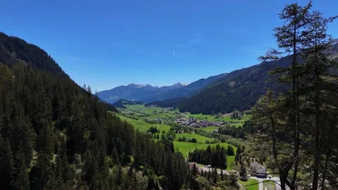 High Angle View of Sunlit Valley Floor and Distant Alpine Peaks 库存影片 343913994