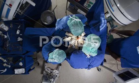 High angle view of a surgery team operating on a patient Stock Photos