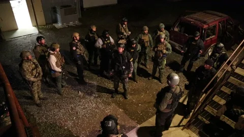 HIgh Angle View of SWAT Trainees Receiving Instructiion Stock Footage 70562794