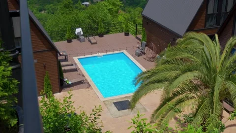 High angle view of swimming pool at a luxury villa resort Stock Footage 342073819