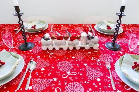 High angle view of table set for Christmas lunch with red tablecloth Stock Photos