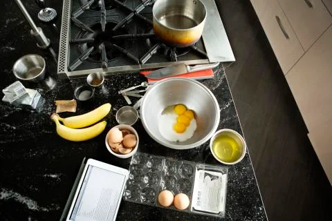 High angle view of tablet computer with ingredients on kitchen counter at home Stock-Fotos
