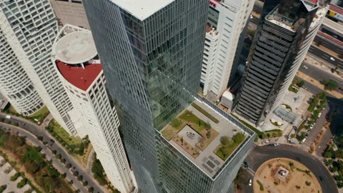High angle view of tall modern glass cover building. Drone camera flying around Stock-Footage 155243597
