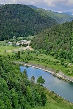 High Angle View of Tarlung River Valley and Green Forested Hills in Sacele Stock Photos