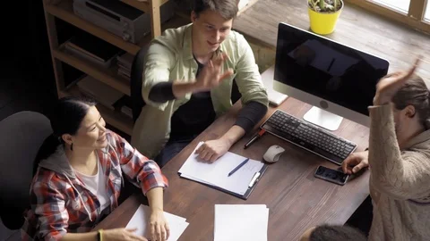 High angle view of team looking at professionals chearing up hands in creative Video stock 126245939