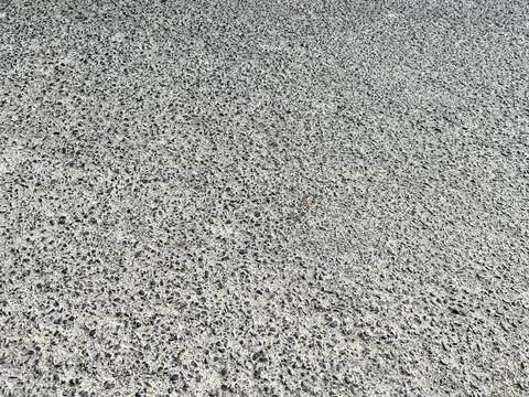 High Angle View of Textured Grey Asphalt Surface on a Public Road Stock Photos