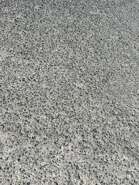 High Angle View of Textured Grey Asphalt Surface on a Public Road Stock Photos