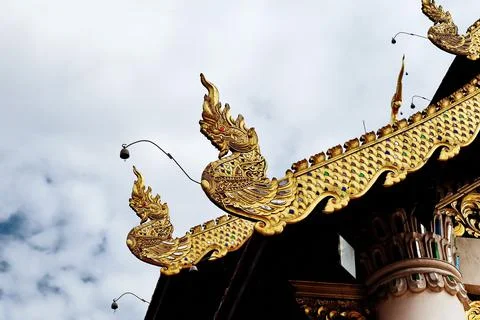 High angle view of Thai temple against white cloud and clear blue sky Stock Photos