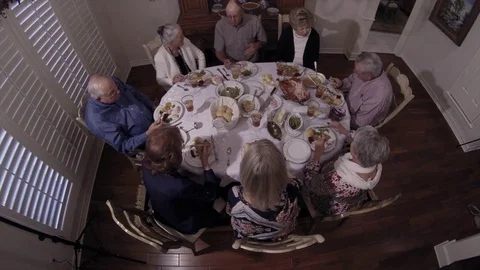 High angle view of Thanksgiving table surrounded by family group, 4K. Stock Footage 85120087