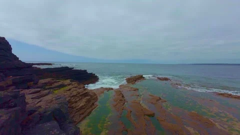 High angle view of tidal pool on rocky beach coast Stock Footage 340450439