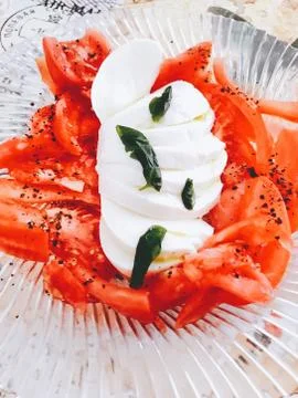 High Angle View Of Tomato Salad With Mozzarella In Bowl On Table Stock Photos