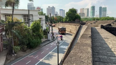 High angle view of a tourist tram tranvia bus in Intramuros Manila 4K Stock Footage 337457892