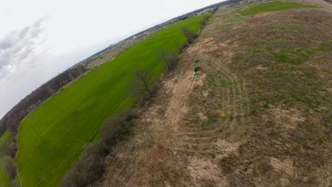 High angle view of a tractor clearing brush for a food plot Stock Photos