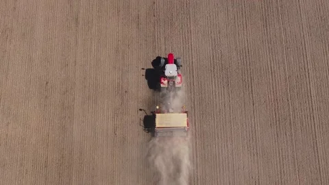High-angle view of a tractor sowing on a field, Agriculture in Finland Stock Footage 241484915