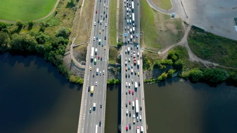 High angle view on traffic on the bridge over water. Summer time. In motion. Stock Footage 141013049