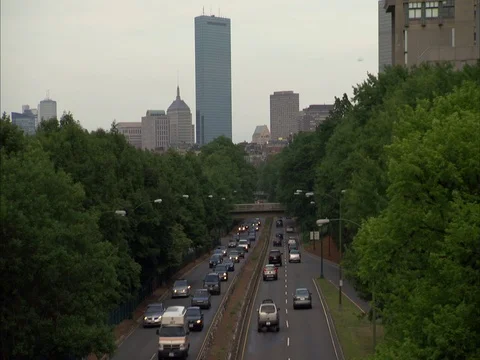 High angle view of traffic moving on Storrow Drive towards Hancock Tower. Stock Footage 86750313