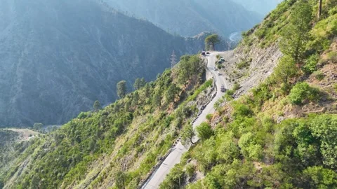 High angle view of transport vehicles driving on winding mountain road. Stock-Footage 337616282