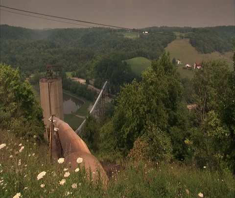 High angle view of trees and rolling hills surrounding Century Mine Stock Footage 86695830