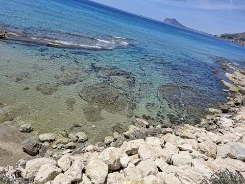 High angle view of turquoise sea water and rocky reef in Calpe Spain Stock Photos
