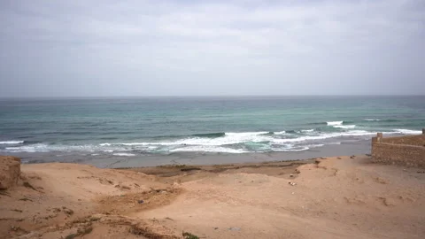 High Angle View of Turquoise Waves Rolling onto a Sandy Coastline Vídeos de archivo 334176895