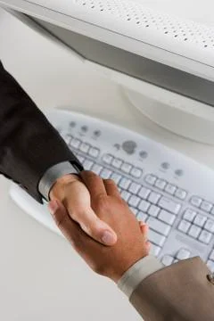 High angle view of two businessman's hands shaking Stock Photos
