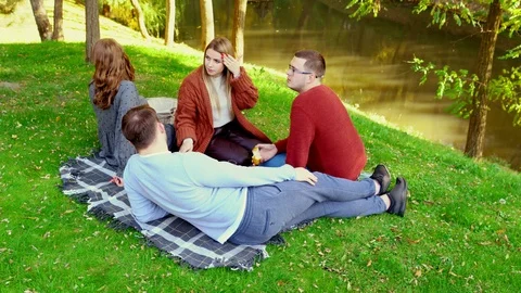 High angle view of two young couples picnicking Stock Footage 118901435