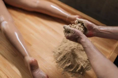 High-angle view of unrecognizable Ayurvedic massage practitioner male mixing Stock Photos