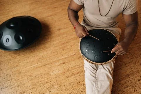 High-angle view of unrecognizable black male in trance enjoying playing using Stock Photos