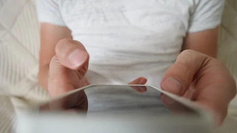 High-angle view of unrecognizable young adult man using cellphone for writing Stock Footage 264159840