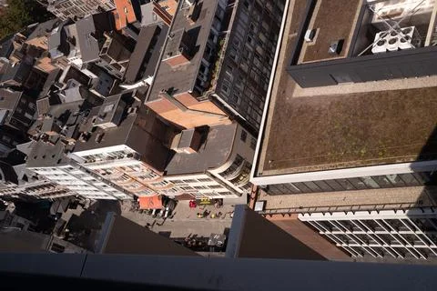High-angle view of urban rooftops and streets below Stock Photos