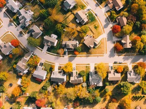 High-Angle View of Urban Streets with Parked Cars and Autumn Trees Stock Photos