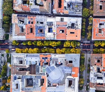 High-Angle View of Urban Streets with Parked Cars and Autumn Trees Stock Photos