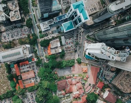 High-Angle View of Urban Streets with Parked Cars and Autumn Trees Stock Photos