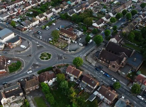 High-Angle View of Urban Streets with Parked Cars and Autumn Trees Stock Photos