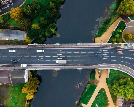 High-Angle View of Urban Streets with Parked Cars and Autumn Trees Stock Photos