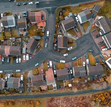 High-Angle View of Urban Streets with Parked Cars and Autumn Trees Stock Photos