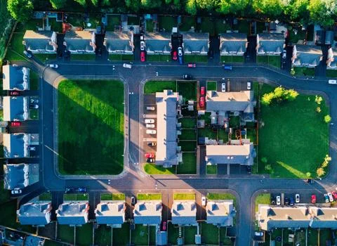 High-Angle View of Urban Streets with Parked Cars and Autumn Trees Stock Photos