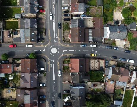 High-Angle View of Urban Streets with Parked Cars and Autumn Trees Stock Photos