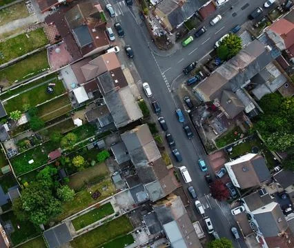 High-Angle View of Urban Streets with Parked Cars and Autumn Trees Stock Photos